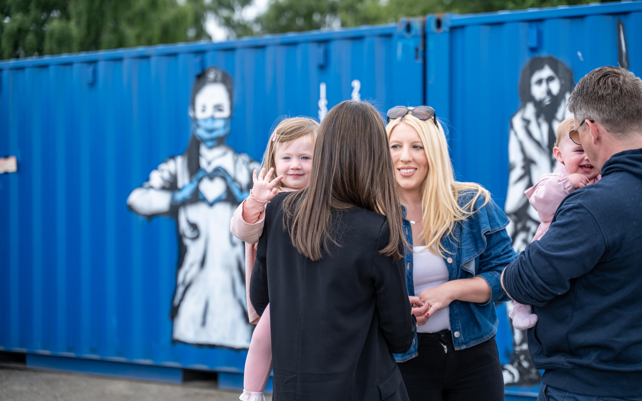 Group of friends visiting the Rebel Bear street art exhibition at Boxxs Self Storage in Linlithgow, a unique open-air gallery for Bo’ness and West Lothian visitors